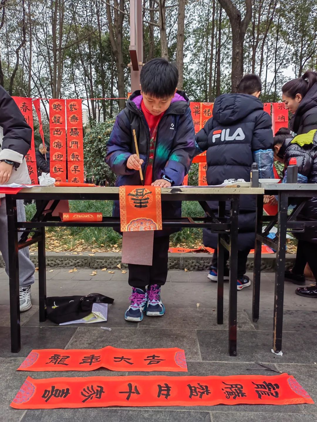 我们的节日•春节——第四届成都市小小书法家“写春联 送春福”公益活动举行